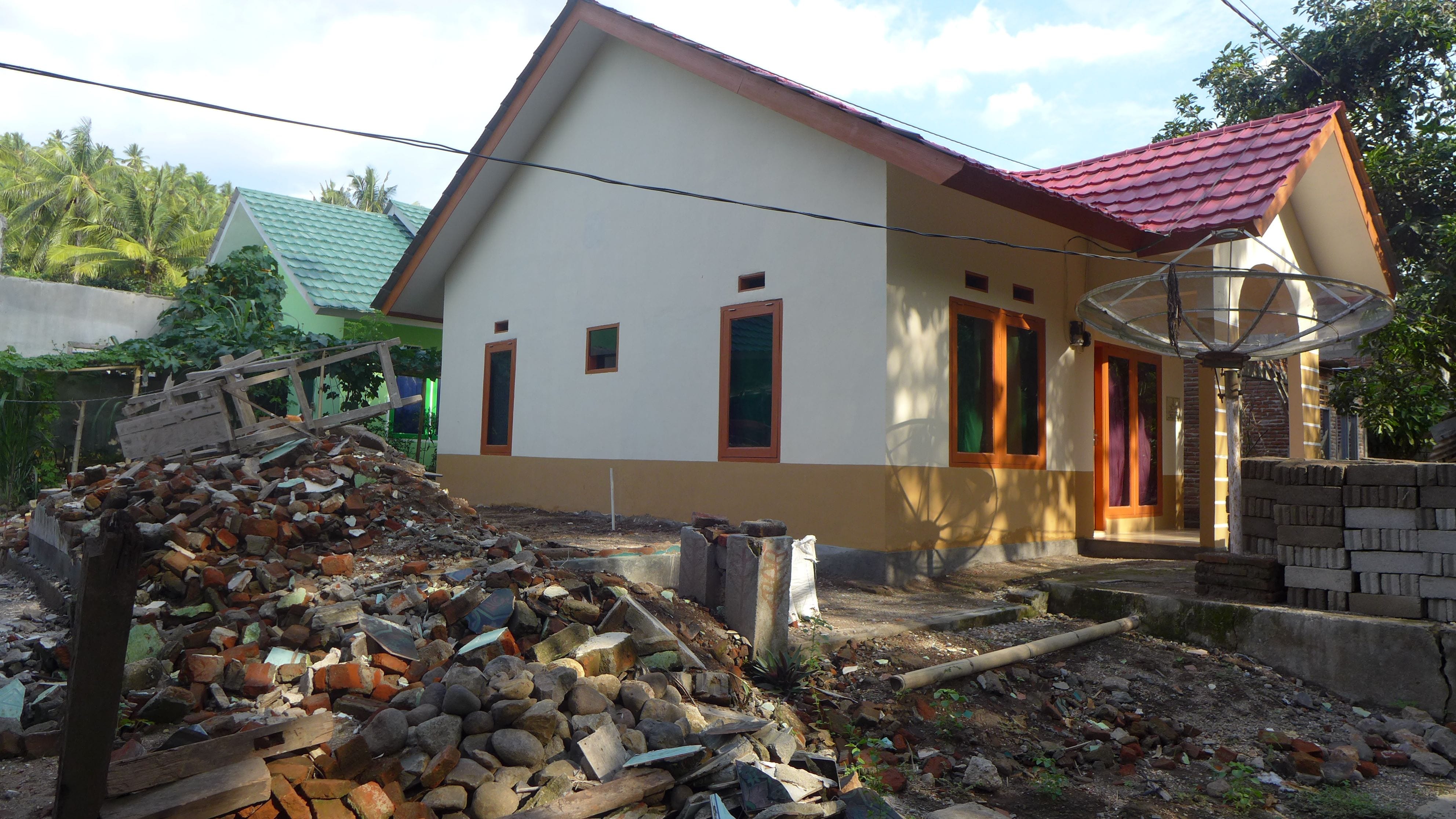 Rebuilt home and earthquake debris in Gol sub village