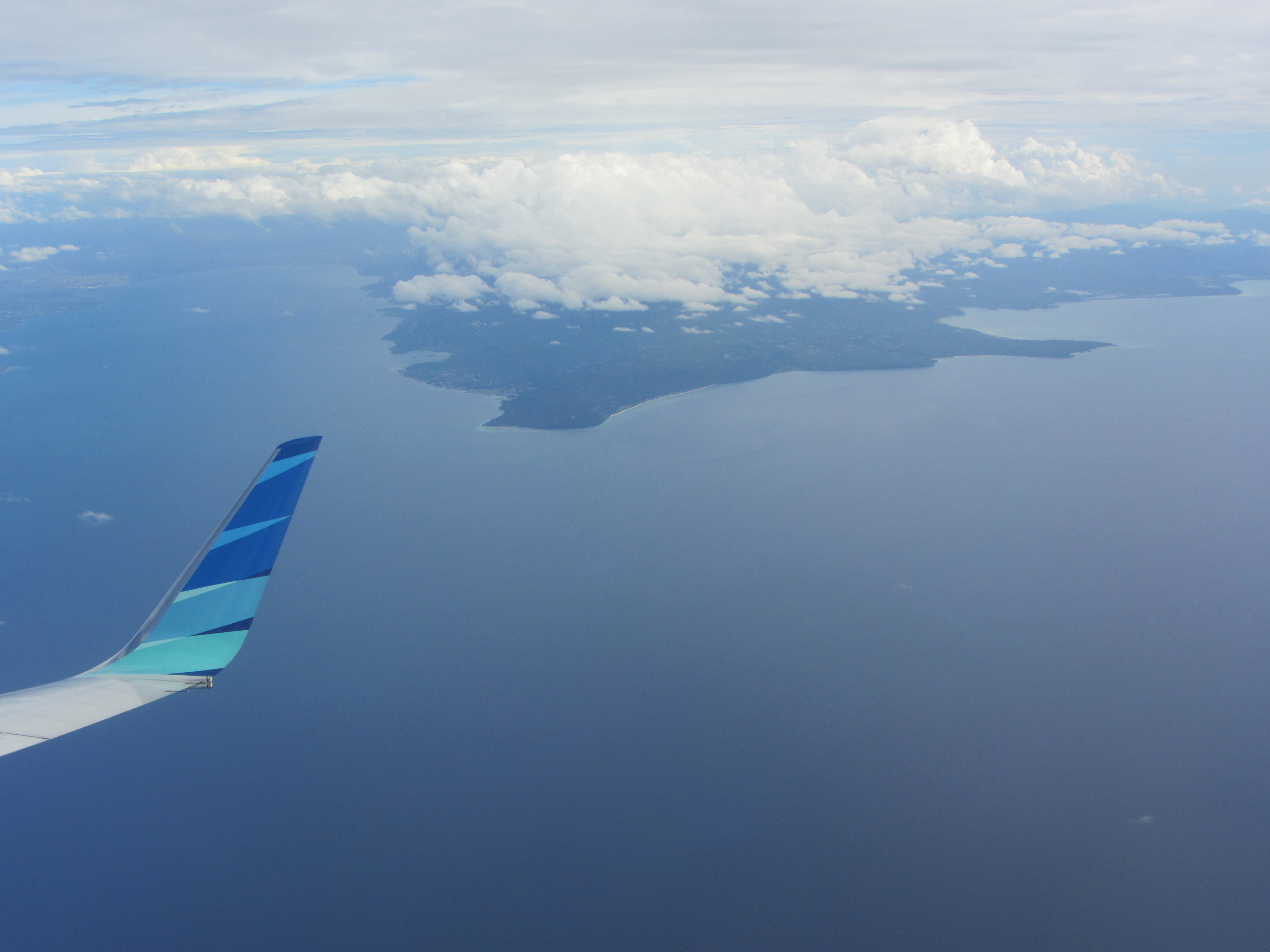A aerial view of the tip of the western peninsula of Donggala District. Palu Bay to the left and the Malacca Straits to the right.